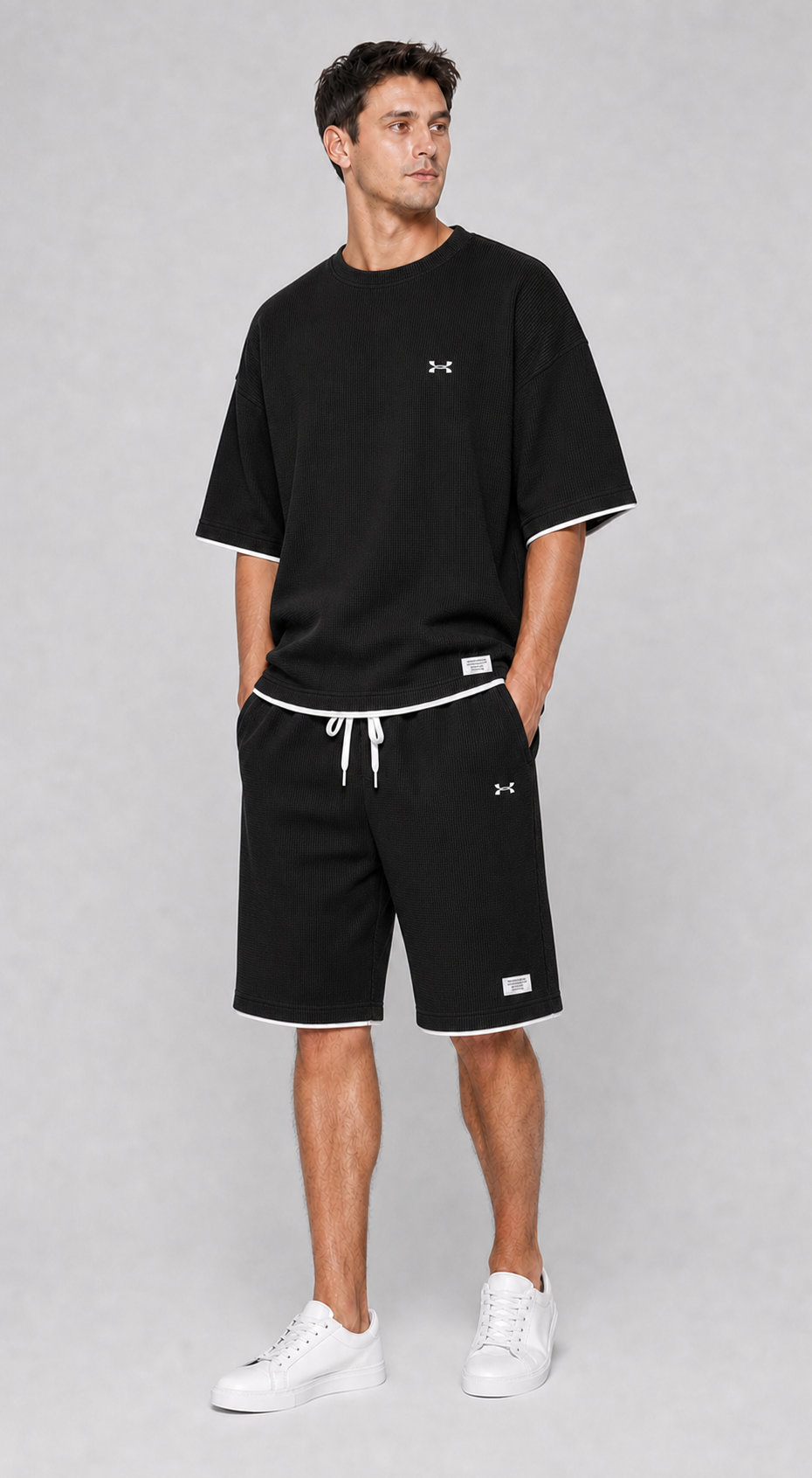 Conjunto deportivo negro de camiseta y pantalón corto para hombre