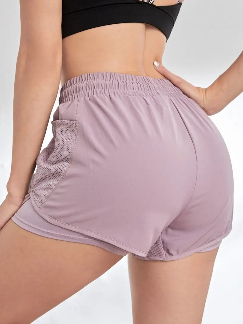 Pantalón corto deportivo elástico con bolsillos para mujer, running y yoga