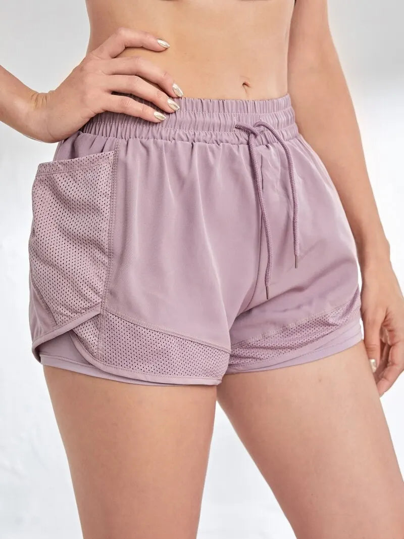 Pantalón corto deportivo elástico con bolsillos para mujer, running y yoga