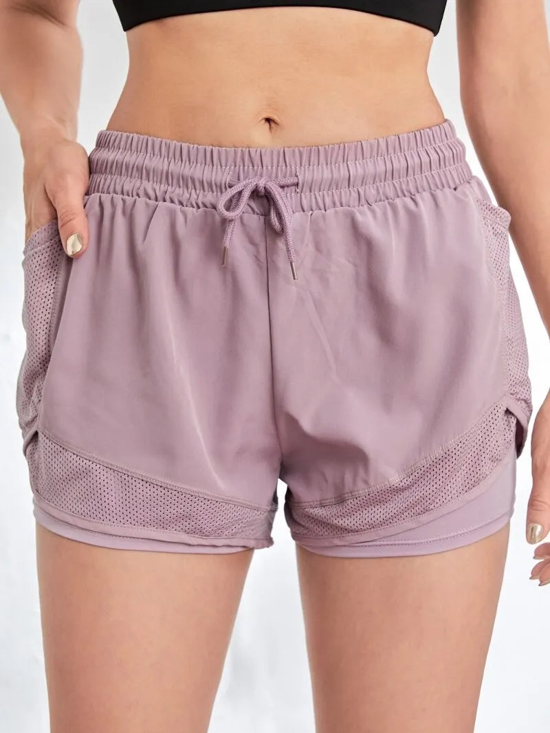 Pantalón corto deportivo elástico con bolsillos para mujer, running y yoga