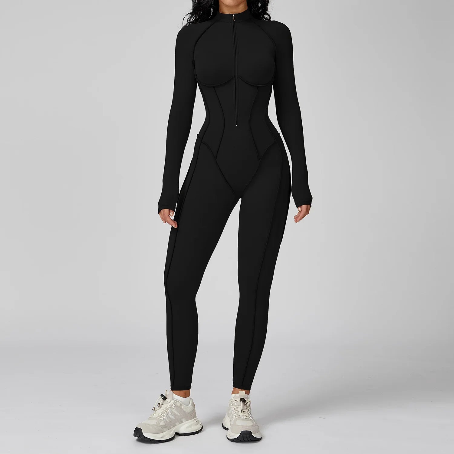 Mono deportivo negro de una pieza con cremallera frontal para mujer